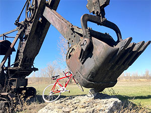 Red bike and Marion Steam Shovel, Leroy, NY by Nicholas Jospe