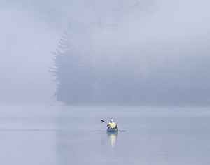 Foggy Morning Kayaker by Carl Crumley